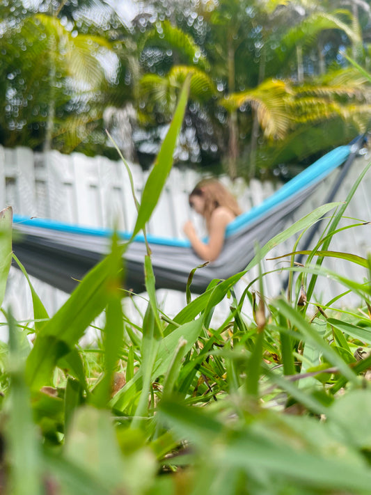 Portable blue and gray hammock for relaxing outside