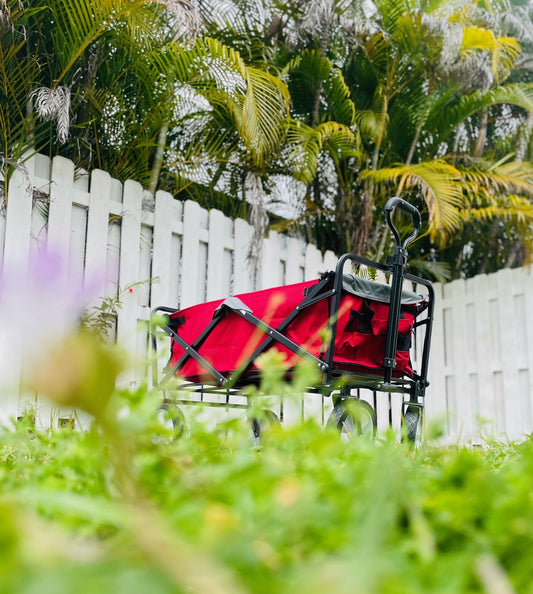 Red utility wagon cart in nature