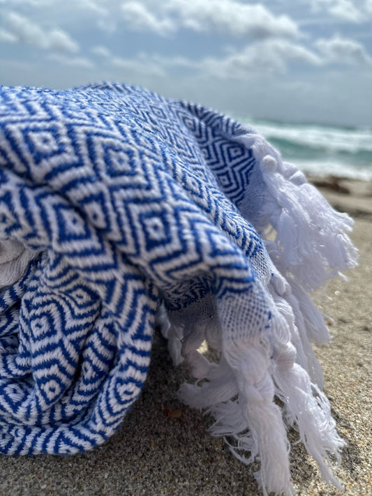 blue soft turkish towel at the beach with rhombus pattern